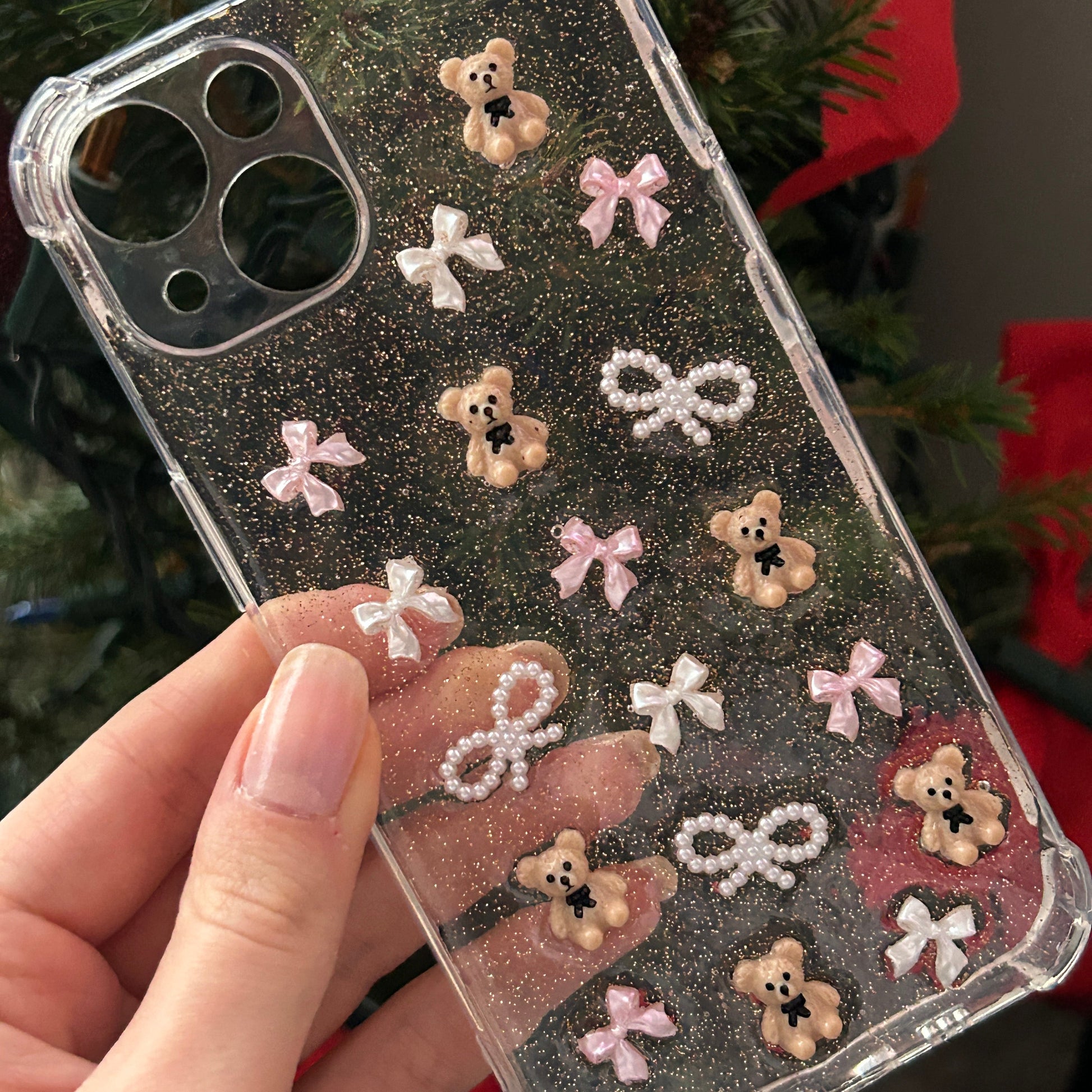 The Sweet Spot Phone Case, Pink and Pearl Bows, Tilted with Christmas Backdrop 